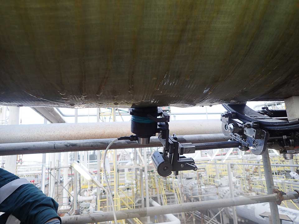 Field Inspection Tool for Composite Overwrap Repairs over Carbon Steel Pipelines and Piping